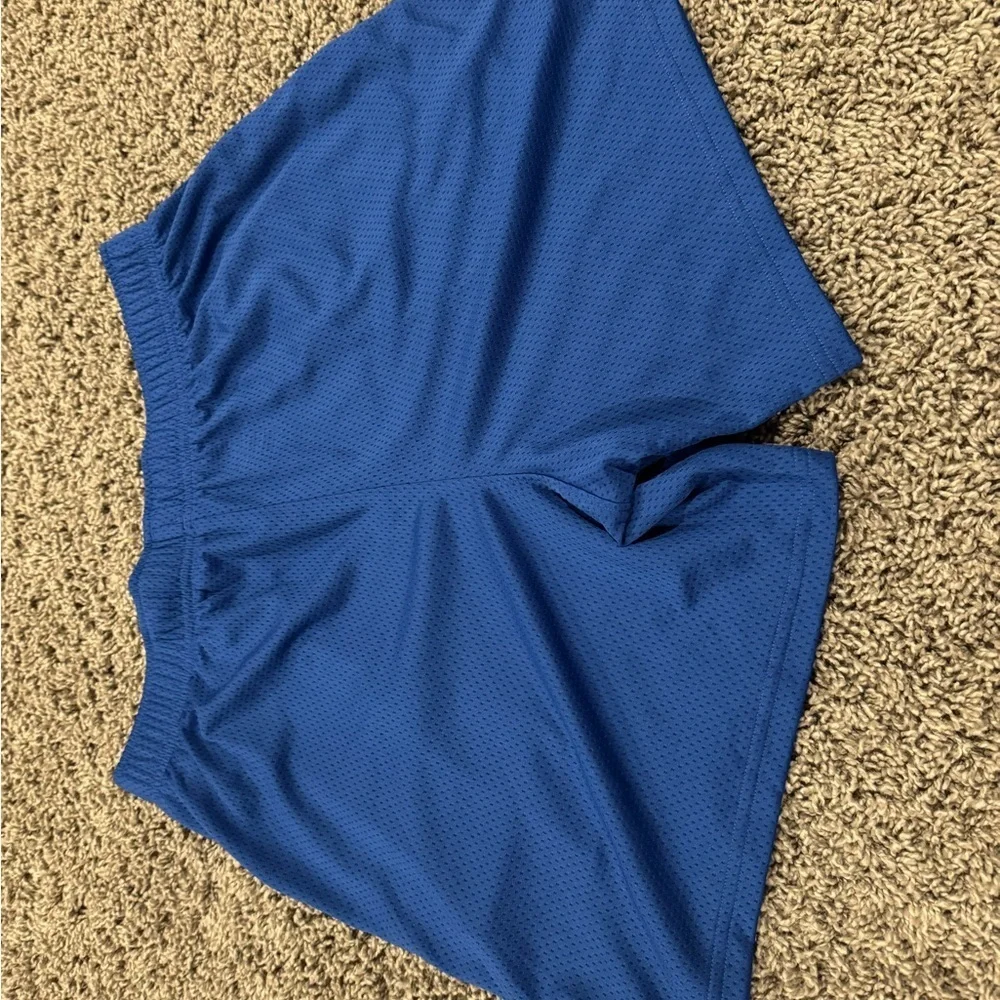 NWT boys Under Armour Athletic Shorts in Royal Blue, size XL.